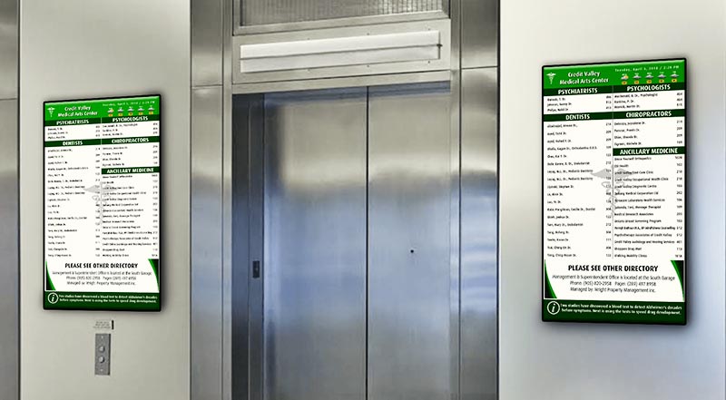 Portrait digital directory beside elevator