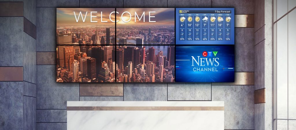 large video wall above reception desk in corporate lobby