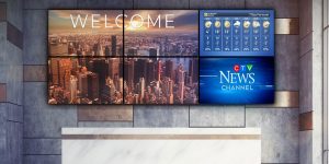 large video wall above reception desk in corporate lobby