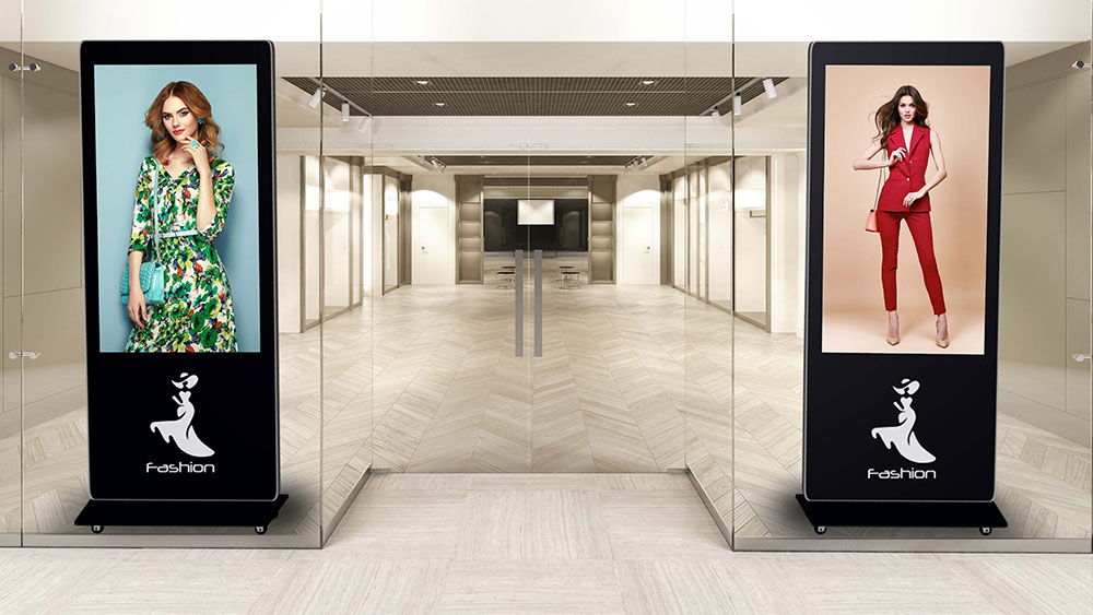 digital kiosks displaying fashion promos at retail store