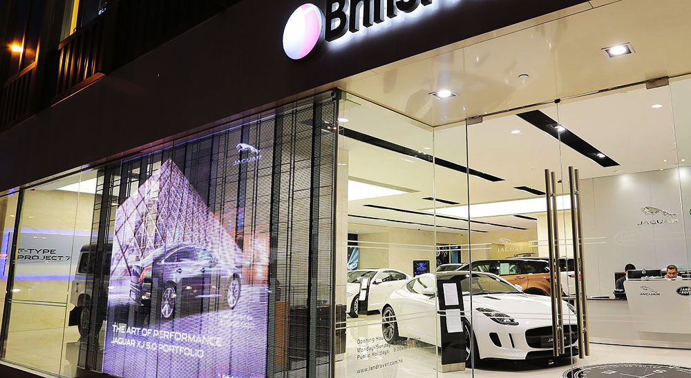 transparent led wall being used behind a car dealership window